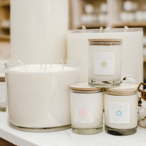Collection of candles with labels on a shelf