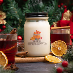 Candle labeled 'Mulled Wine' with holiday decorations in the background