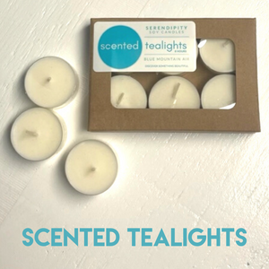 Box of scented tealights with teal text overlay on a light background